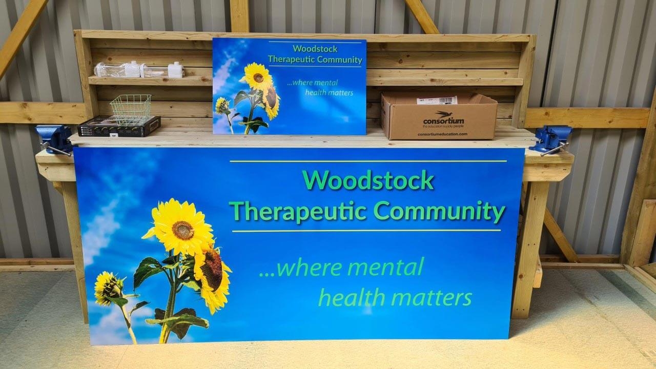 Woodstock therapeutic community sign on work top.