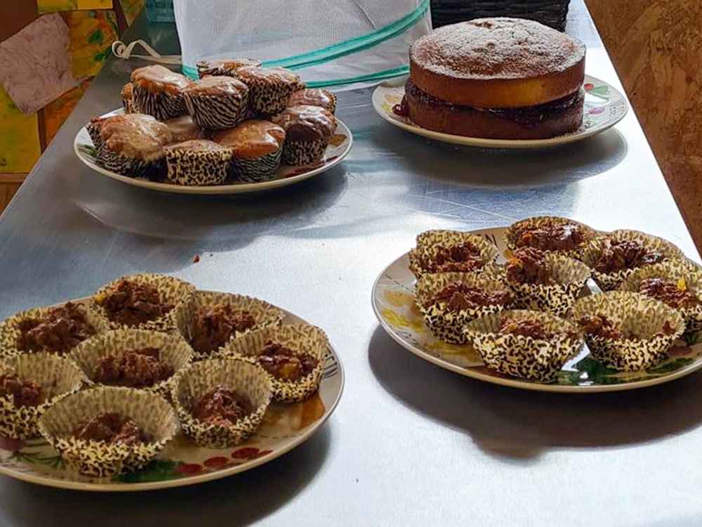 Various cakes on a table after being baked.