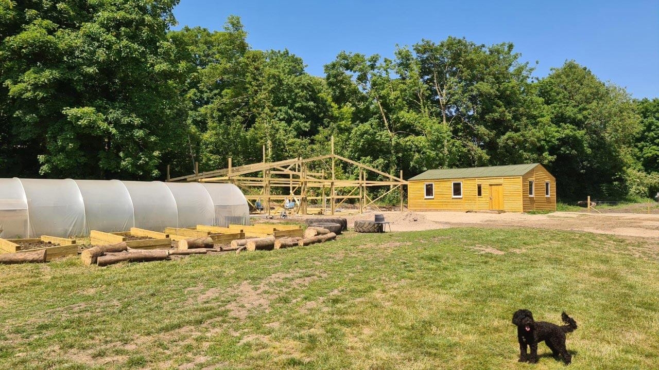 New large building during construction with wooden frame in place.